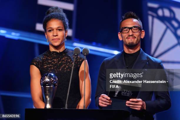 Japan's former player Hidetoshi Nakata and Germany's Celia Sasic come on stage to present The Best FIFA Women's Player during The Best FIFA Football...