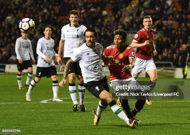 Danny Ings of Liverpool and Demetri Mitchell of Manchester United in action during the Manchester United v Liverpool Premier League 2 game at Leigh...