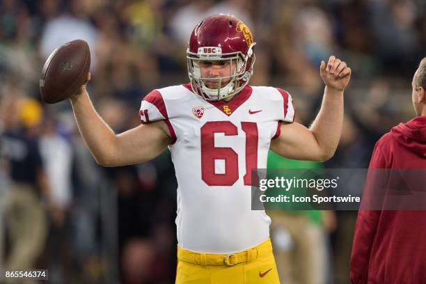 Trojans long snapper Jake Olson warms up before the college football game between the Notre Dame Fighting Irish and USC Trojans on October 21 at...