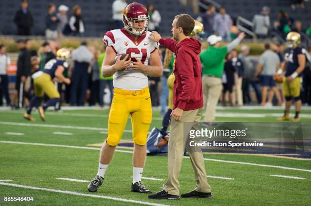 Trojans long snapper Jake Olson warms up before the college football game between the Notre Dame Fighting Irish and USC Trojans on October 21 at...