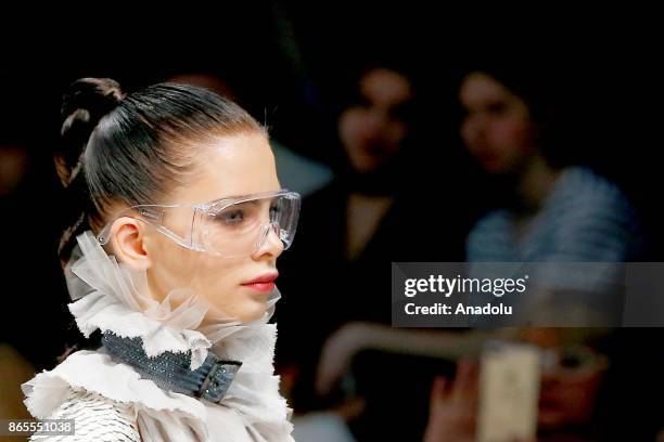 Model presents a creation by Russian designer Julia Dalakian during the Mercedes-Benz Fashion Week in Moscow, Russia on October 23, 2017.