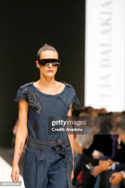 Model presents a creation by Russian designer Julia Dalakian during the Mercedes-Benz Fashion Week in Moscow, Russia on October 23, 2017.