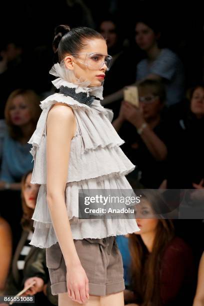 Model presents a creation by Russian designer Julia Dalakian during the Mercedes-Benz Fashion Week in Moscow, Russia on October 23, 2017.