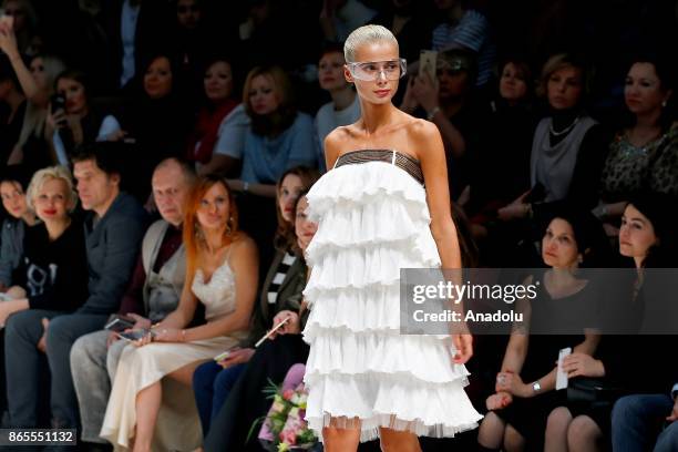 Model presents a creation by Russian designer Julia Dalakian during the Mercedes-Benz Fashion Week in Moscow, Russia on October 23, 2017.