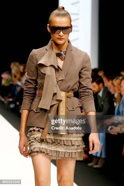 Model presents a creation by Russian designer Julia Dalakian during the Mercedes-Benz Fashion Week in Moscow, Russia on October 23, 2017.