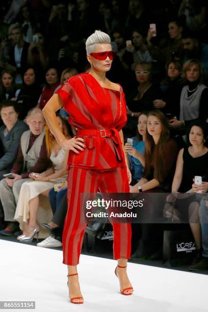 Model presents a creation by Russian designer Julia Dalakian during the Mercedes-Benz Fashion Week in Moscow, Russia on October 23, 2017.