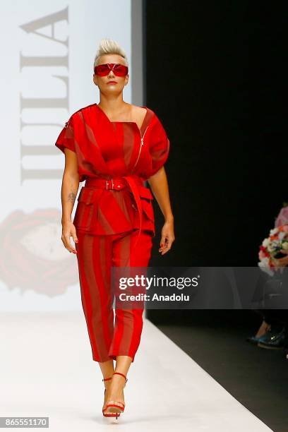 Model presents a creation by Russian designer Julia Dalakian during the Mercedes-Benz Fashion Week in Moscow, Russia on October 23, 2017.