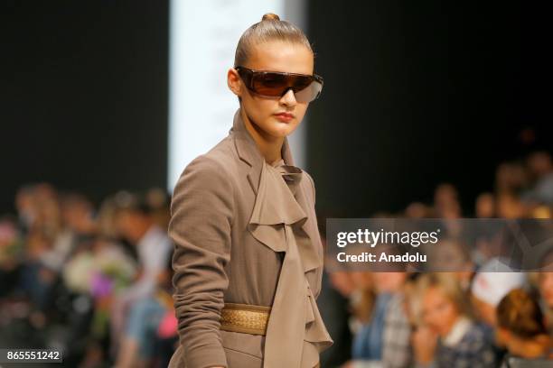 Model presents a creation by Russian designer Julia Dalakian during the Mercedes-Benz Fashion Week in Moscow, Russia on October 23, 2017.