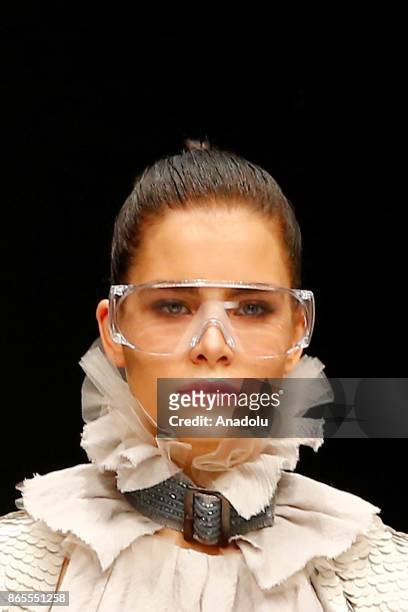 Model presents a creation by Russian designer Julia Dalakian during the Mercedes-Benz Fashion Week in Moscow, Russia on October 23, 2017.