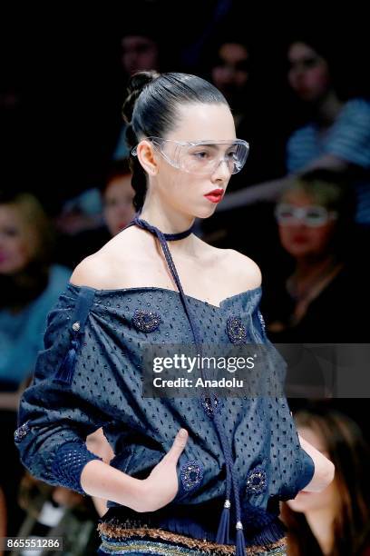 Model presents a creation by Russian designer Julia Dalakian during the Mercedes-Benz Fashion Week in Moscow, Russia on October 23, 2017.