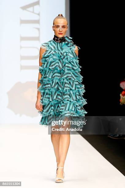 Model presents a creation by Russian designer Julia Dalakian during the Mercedes-Benz Fashion Week in Moscow, Russia on October 23, 2017.