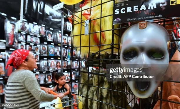 Mask from the tv series "Scream" is displayed at a store selling Halloween merchandise in Alhambra, California on October 23, 2017. According to a...