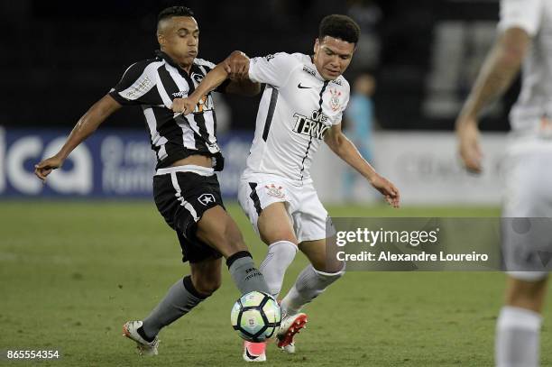 Arnaldo of Botafogo battles for the ball with Marquinhos Gabriel of Corinthians during the match between Botafogo and Corinthians as part of...