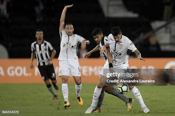 Brenner of Botafogo battles for the ball with Pedro Henrique of Corinthians during the match between Botafogo and Corinthians as part of Brasileirao...