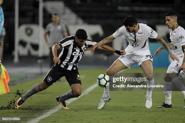 Brenner of Botafogo battles for the ball with Pedro Henrique of Corinthians during the match between Botafogo and Corinthians as part of Brasileirao...