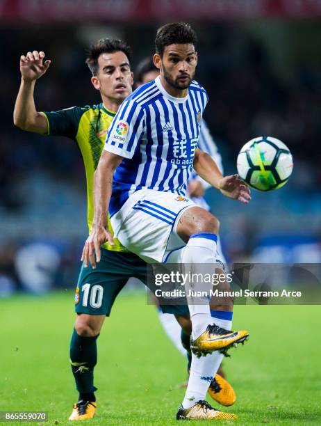 Jose Manuel Jurado of RCD Espanyol duels for the ball with Willian Jose Da Silva of Real Sociedad during the La Liga match between Real Sociedad de...
