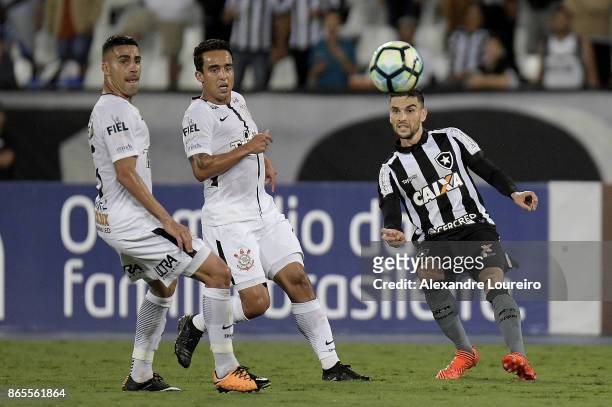 Rodrigo Pimpao of Botafogo battles for the ball with Gabriel and Jadson of Corinthians during the match between Botafogo and Corinthians as part of...