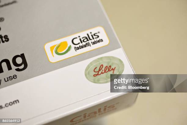 Box of Eli Lilly & Co. Cialis brand medication is arranged for a photograph at a pharmacy in Princeton, Illinois, U.S., on Monday, Oct. 23, 2017. Eli...
