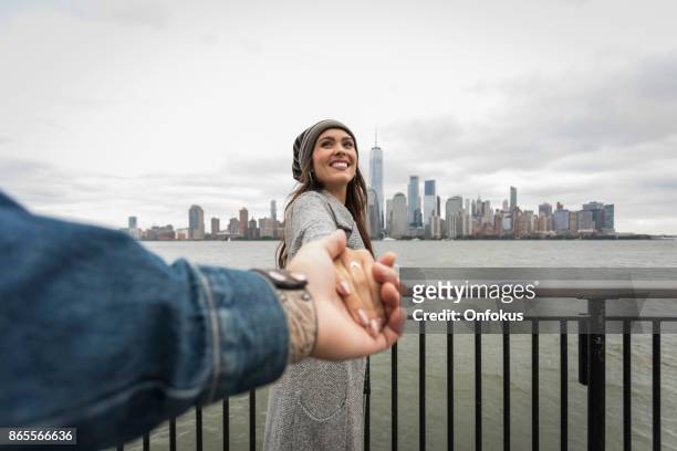 follow me concept - couple traveling in new york city - follow me stock pictures, royalty-free photos & images