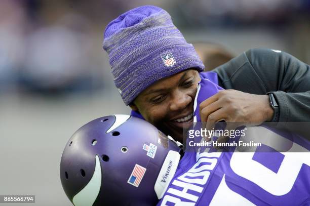 Teddy Bridgewater of the Minnesota Vikings hugs teammate Xavier Rhodes before the game against the Baltimore Ravens on October 22, 2017 at US Bank...