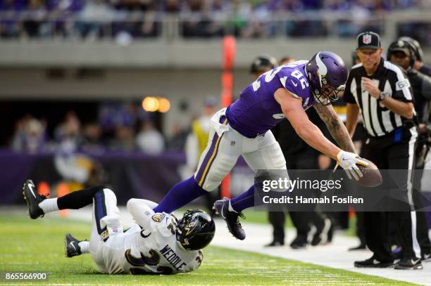 Eric Weddle of the Baltimore Ravens tackles Kyle Rudolph of the Minnesota Vikings during the game on October 22, 2017 at US Bank Stadium in...
