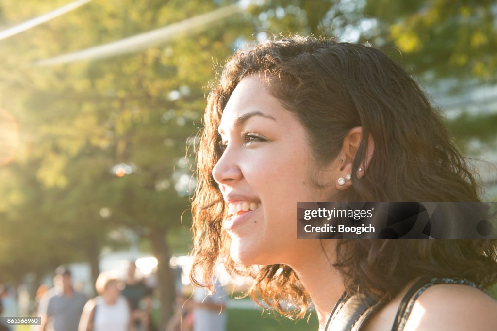 Portrait of Happy Millennial Hispanic Woman in Chicago Park