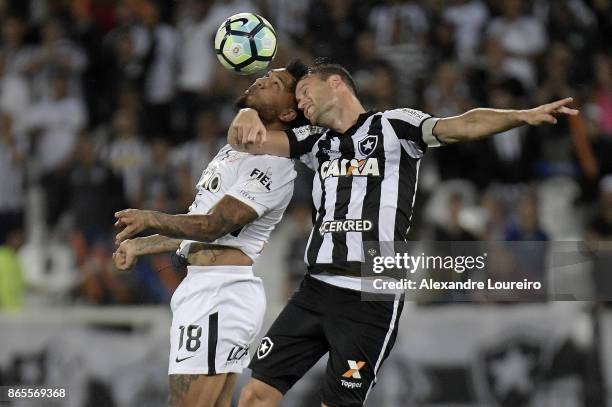 Joel Carli of Botafogo battles for the ball with Kazim of Corinthians during the match between Botafogo and Corinthians as part of Brasileirao Series...