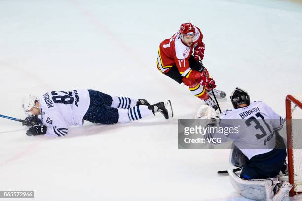 Bobkov Igor and Morrisonn Shaone of Admiral Vladivostok defend against Brule Gilbert of HC Kunlun Red Star in their 2017/18 KHL Regular Season ice...