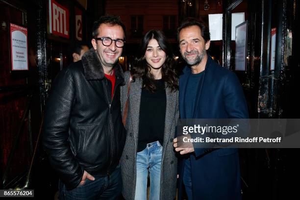 Hosts Cyrille Eldin, his companion Sandrine Calvayrac and actor Stephane De Groodt attend the "Ramses II" Theater Play at Theatre des Bouffes...
