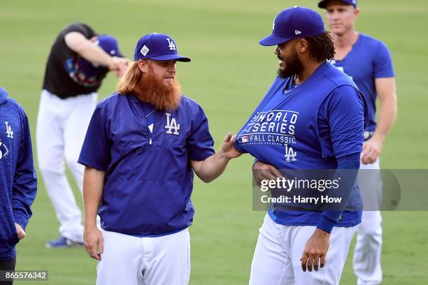 Justin Turner talks with Kenley Jansen of the Los Angeles Dodgers ahead of the World Series at Dodger Stadium on October 23, 2017 in Los Angeles,...