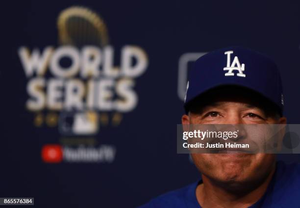 Manager Dave Roberts of the Los Angeles Dodgers answers questions from the media ahead of the World Series at Dodger Stadium on October 23, 2017 in...