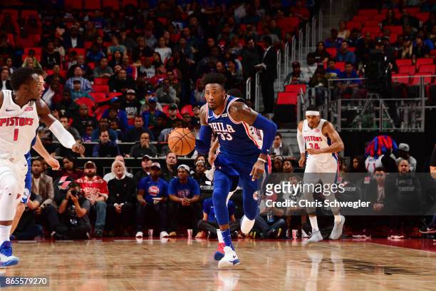 Robert Covington of the Philadelphia 76ers drives against the Detroit Pistons on October 23, 2017 at Little Caesars Arena in Detroit, Michigan. NOTE...