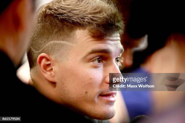Enrique Hernandez of the Los Angeles Dodgers answers questions from the media ahead of the World Series at Dodger Stadium on October 23, 2017 in Los...