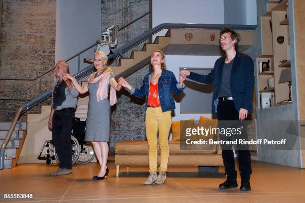 Actors Francois Berleand, Evelyne Buyle, Elise Diamant and Eric Elmosnino acknowledge the applause of the audience at the end of the "Ramses II"...