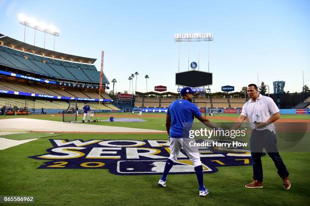 Curtis Granderson of the Los Angeles Dodgers talks with Alex Rodriguez of Fox Sports on the field ahead of the World Series at Dodger Stadium on...