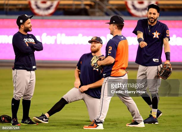 Jose Altuve, Derek Fisher, Alex Bregman and Marwin Gonzalez of the Houston Astros practice ahead of the World Series at Dodger Stadium on October 23,...