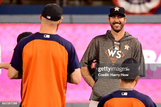 Justin Verlander of the Houston Astros talks with his teammates during practice ahead of the World Series at Dodger Stadium on October 23, 2017 in...