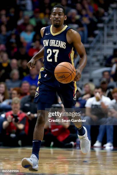 Jordan Crawford of the New Orleans Pelicans dribbles the ball down court during a game against the Golden State Warriors at Smoothie King Center on...