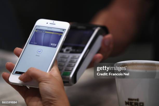Customer makes a transaction using Apple Pay in the UAE at The Dubai Mall on October 22, 2017 in Dubai, United Arab Emirates.