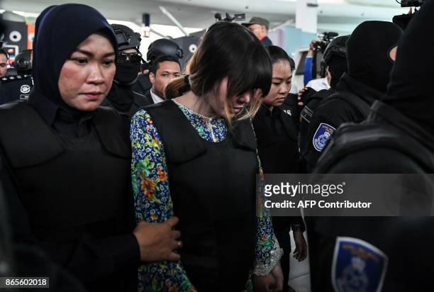 Vietnamese defendant Doan Thi Huong is escorted by police personnel towards the low-cost carrier Kuala Lumpur International Airport 2 in Sepang...