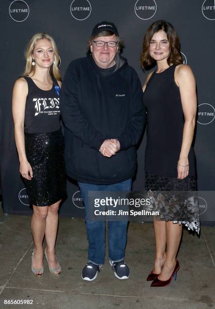 Actress Betsy Brandt, filmmaker Michael Moore and Marin Ireland attend the "Flint" New York screening at NeueHouse Madison Square on October 23, 2017...
