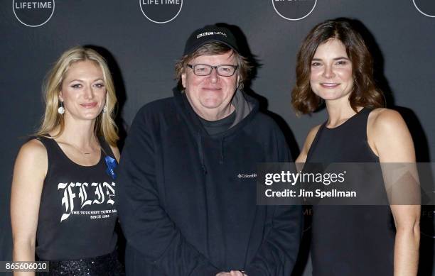 Actress Betsy Brandt, filmmaker Michael Moore and Marin Ireland attend the "Flint" New York screening at NeueHouse Madison Square on October 23, 2017...