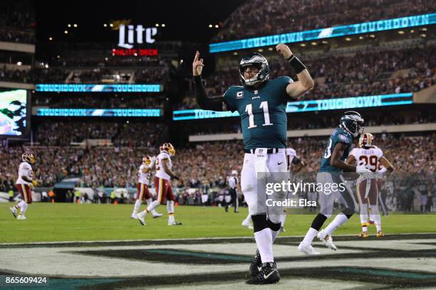 Quarterback Carson Wentz of the Philadelphia Eagles celebrates a touchdown by teammate Nelson Agholor during the fourth quarter of the game against...