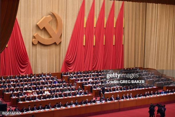 General view shows delegates attending the closing of the 19th Communist Party Congress at the Great Hall of the People in Beijing on October 24,...