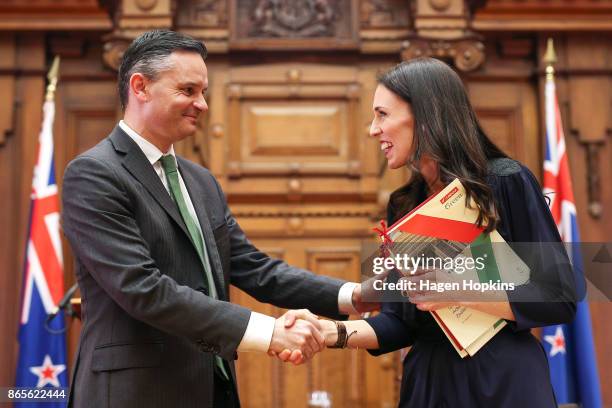 Prime Minister-designate Jacinda Ardern and Green Party leader James Shaw shake hands during a confidence and supply agreement signing at Parliament...