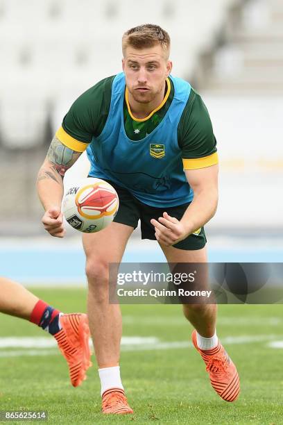 Cameron Munster of Australia passes the ball during an Australian Kangaroos training session at Lakeside Stadium on October 24, 2017 in Melbourne,...
