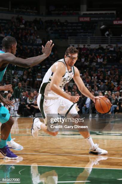 Mirza Teletovic of the Milwaukee Bucks handles the ball against the Charlotte Hornets on October 23, 2017 at the BMO Harris Bradley Center in...