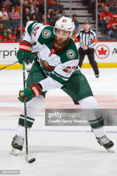 Kyle Quincey of the Minnesota Wild looks for a pass in an NHL game against of the Calgary Flames at the Scotiabank Saddledome on October 21, 2017 in...