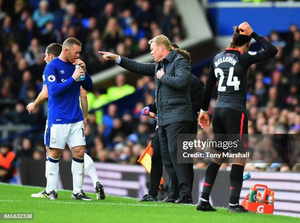 Ronald Koeman, Manager of Everton speaks to Wayne Rooney of Everton during the Premier League match between Everton and Arsenal at Goodison Park on...