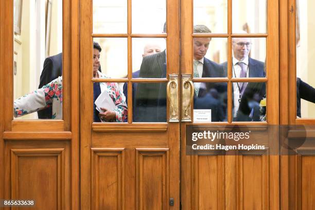 National Party leader Bill English and deputy leader Paula Bennett get stuck behind a security door on their way to a post caucus press conference at...